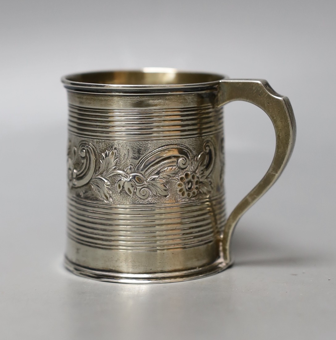 A William IV silver christening mug, with reeded and embossed decoration, London, 1834, 63mm, 98 grams